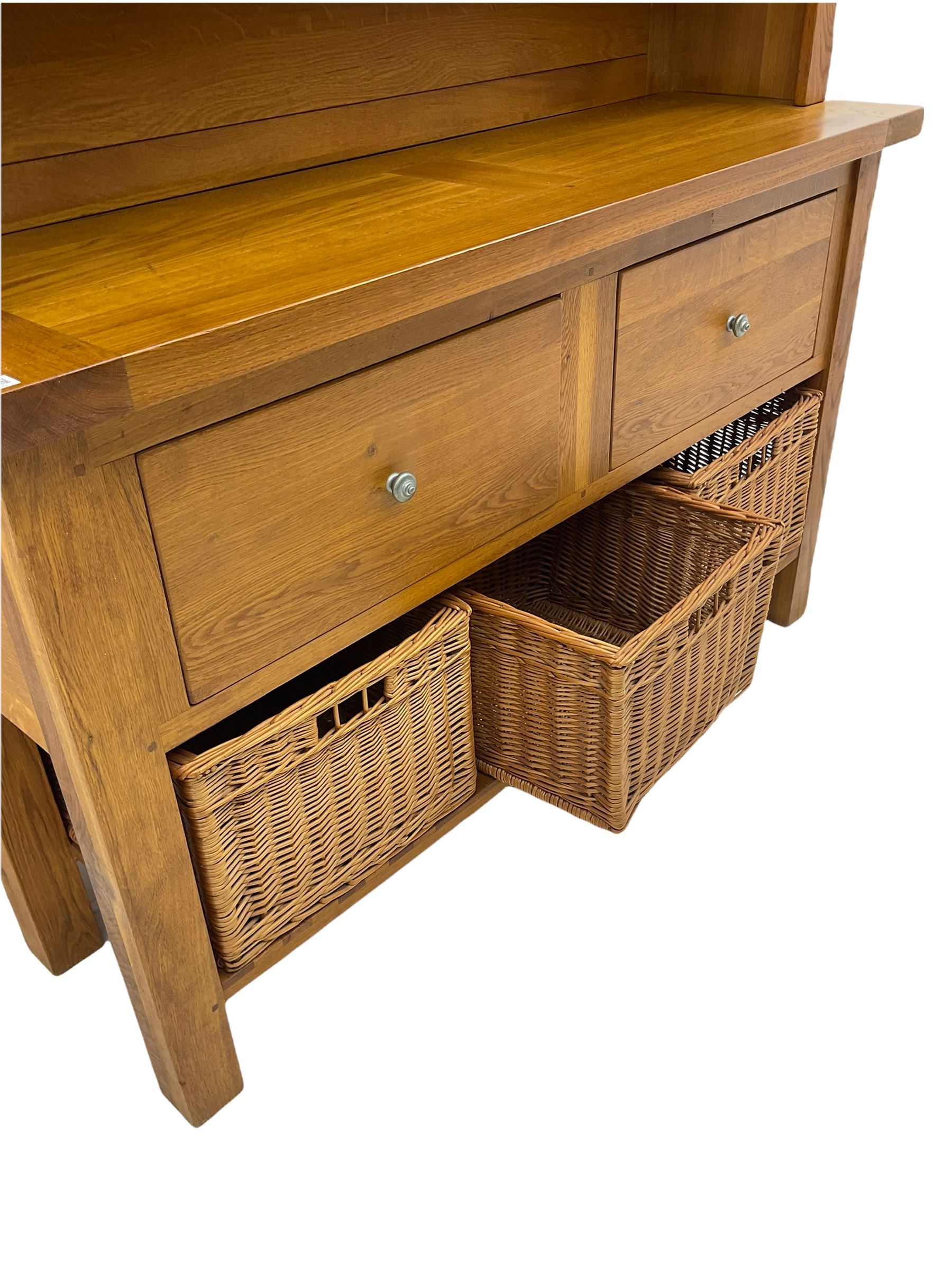 Manor Oak - light oak dresser and rack, fitted with two shelves with three drawers, two deep drawers and pot baked base with basket storage