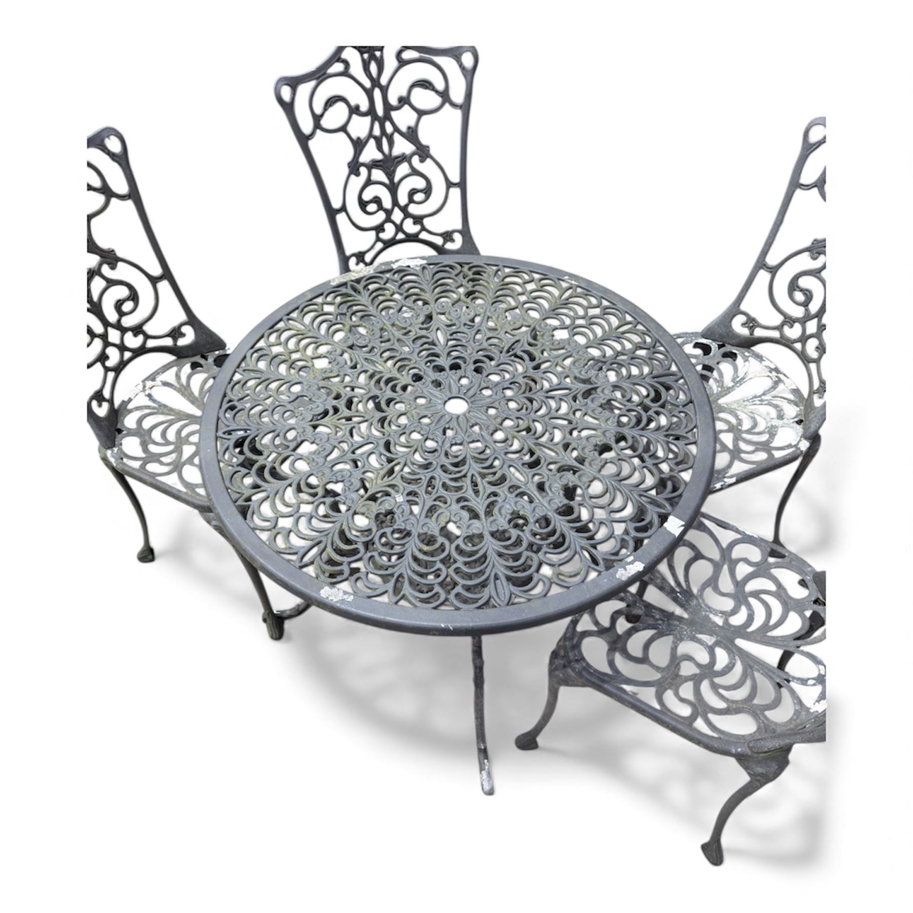 Cast aluminium garden table and four chairs in dark grey