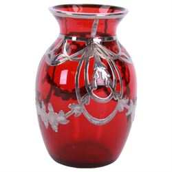 Early 20th century, ruby glass vase vase, with silver overlay of flower swags, impressed sterling H9cm, together with a similar wall vase H21cm,  