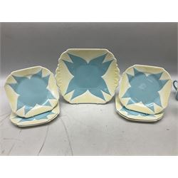 Shelley Dainty pattern tea wares, of lobed form with blue star decoration on merging white and yellow ground, comprising five teacups, five saucers, six tea plates, milk jug and cake plate, all with printed green mark beneath, some with painted pattern no 11770