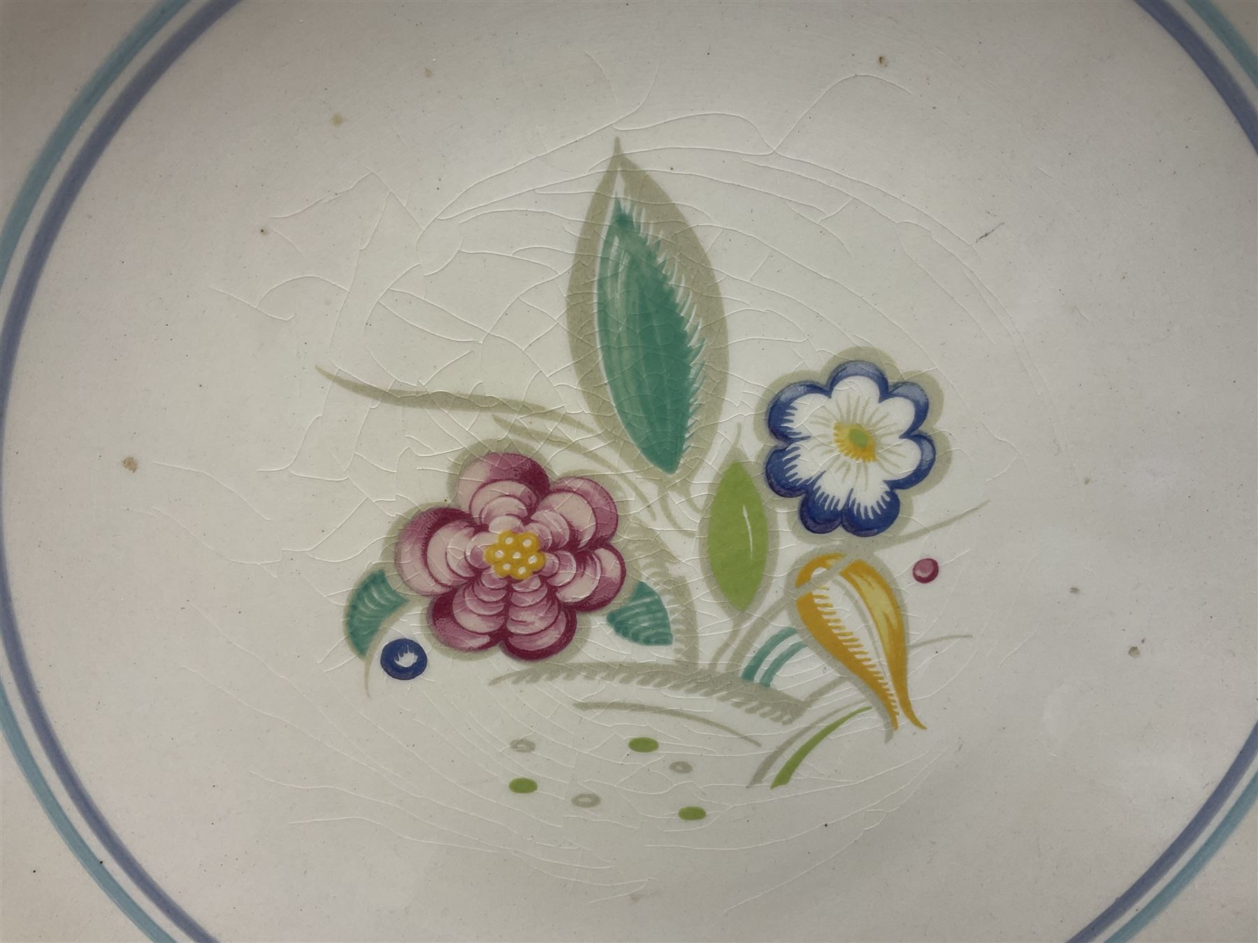Susie Cooper Nosegay pattern tea service, teapot, eight cups and saucers, six dessert plates, three graduating jugs, covered twin handled sucrier, open sucrier  and cake plate 