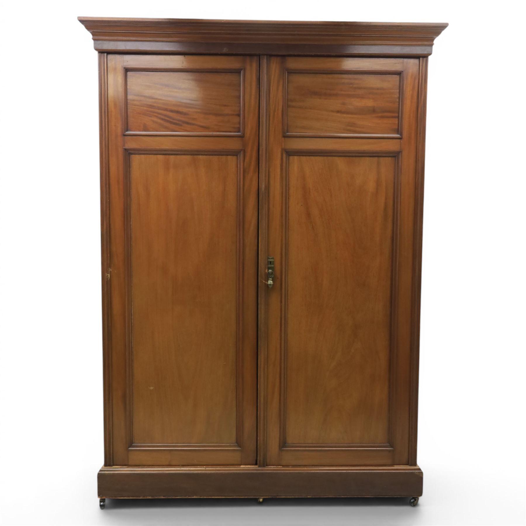 Edwardian walnut double wardrobe, fitted with two panelled doors, opening to reveal fitted interior with hanging space, three sliding linen trays and three drawers