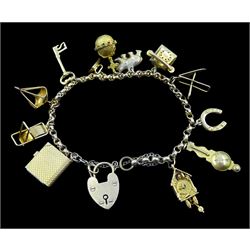 Gold bracelet with heart locket and twelve charms including cuckoo clock, bear, book and telephone, hallmarked or tested
