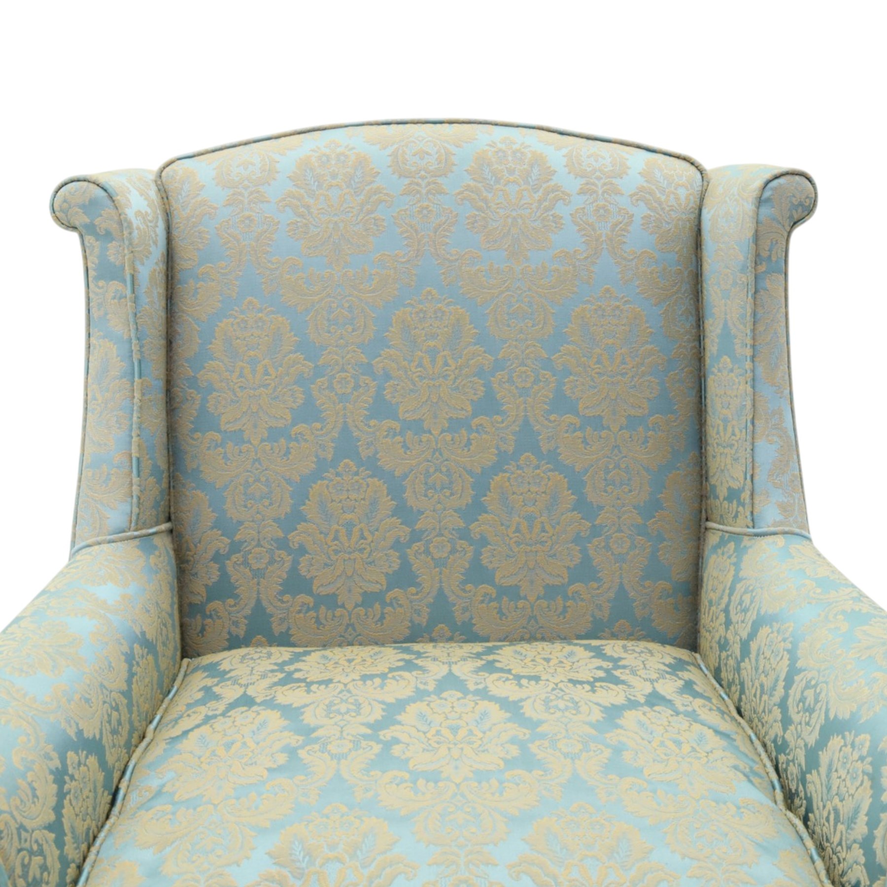 Georgian design carved mahogany framed wingback armchair, high wingback over sprung seat and loose cushion with rolled arms, upholstered in cyan ground gilt foliate damask fabric, on shell-carved cabriole supports with pad feet