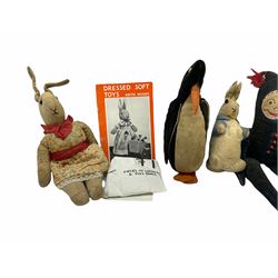 1950's teddy bear with jointed limbs, revolving head, wood filled body, stitched nose and mouth, applied glass eyes and foot pads, together with a quantity of handmade soft toy rabbits and penguins. 