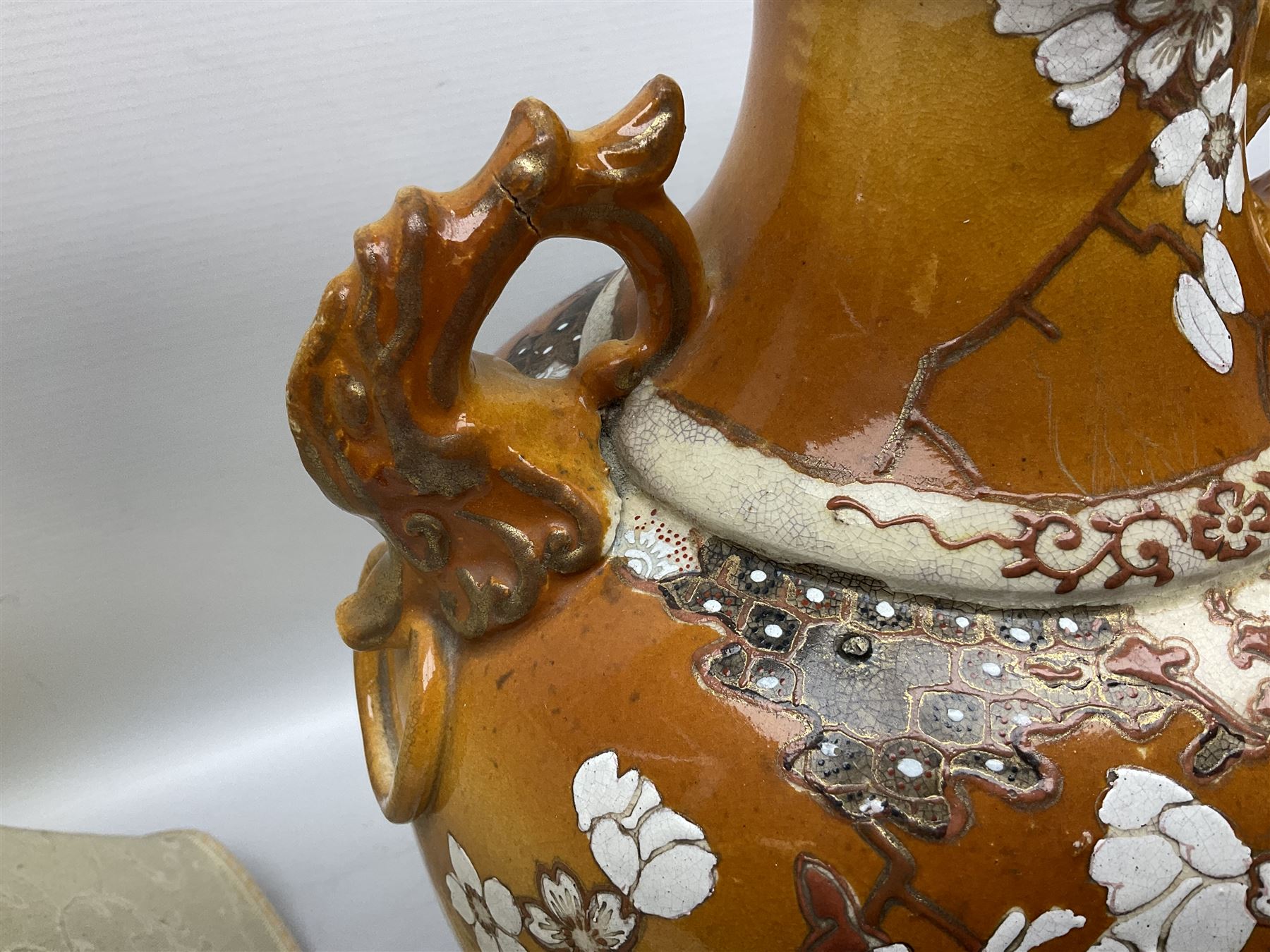 20th century Japanese vase converted to a lamp, the baluster form body decorated with samurai warriors and blossoming branches with twin handles, with wood base and fixtures, with tasselled fabric shade, H56cm excl shade