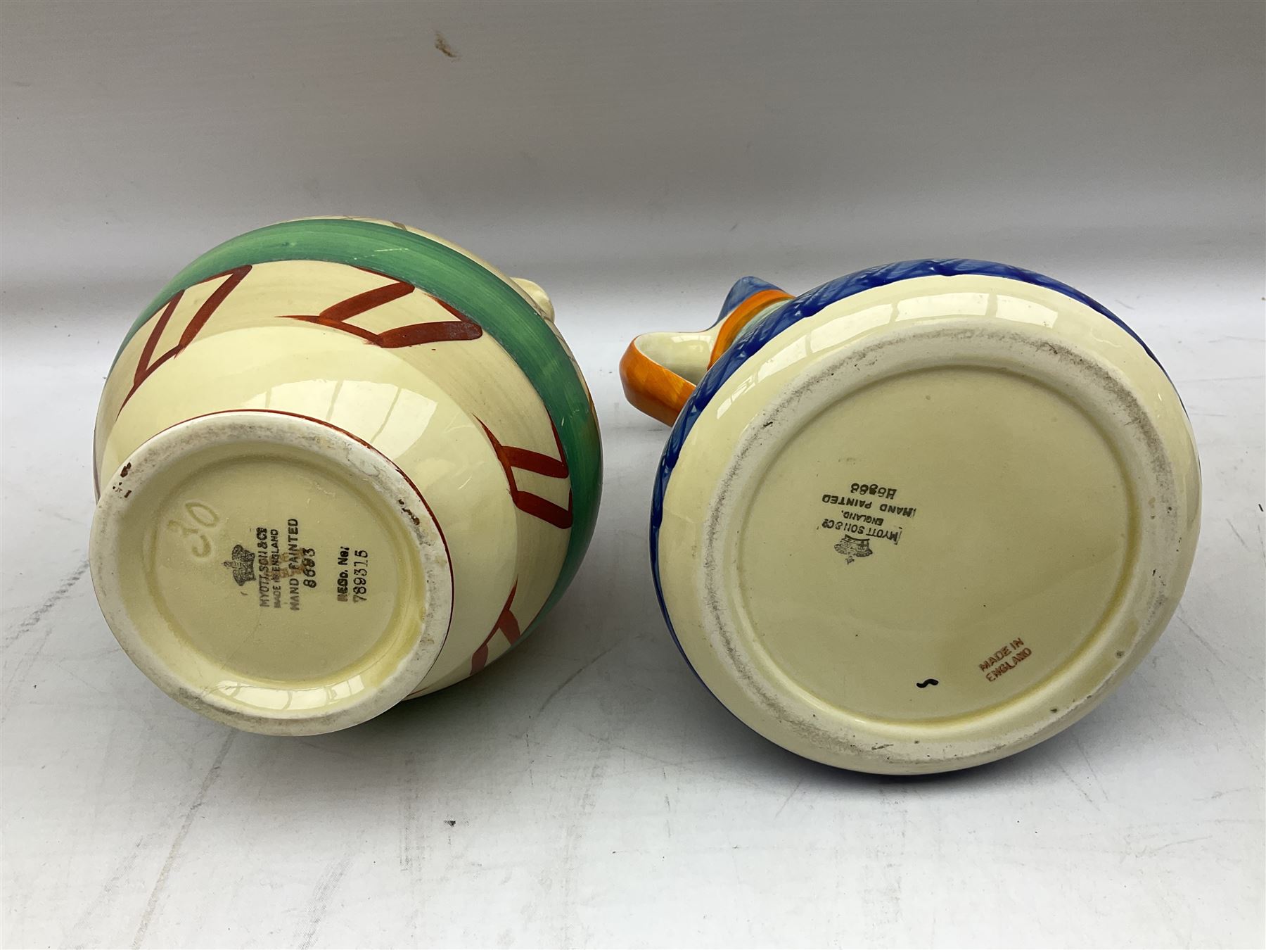 Seven Myott Son & Co hand painted jugs, all with printed mark beneath, H21cm