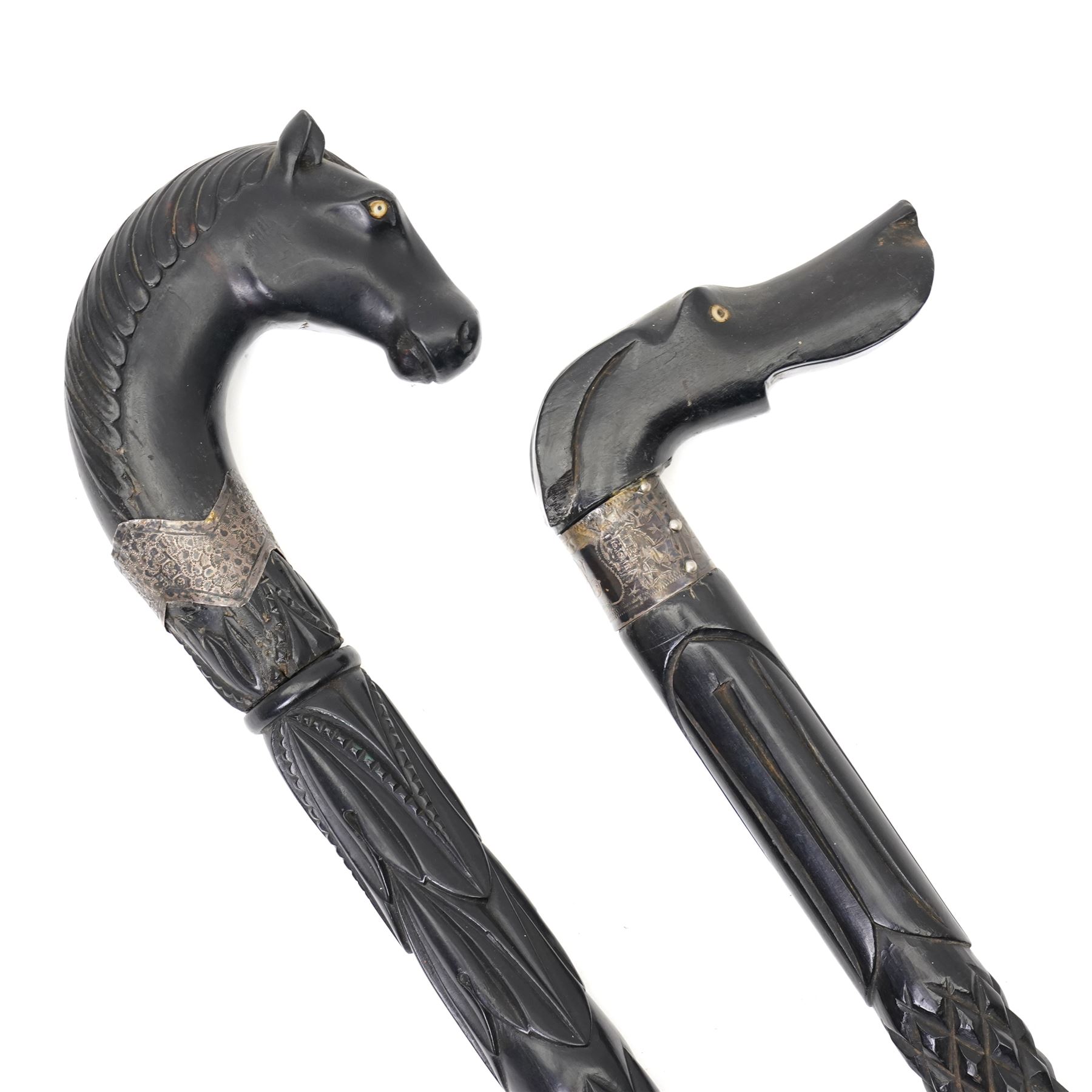 Edwardian ebonised evening cane with silver collar and horses head handle Birmingham 1906 and another with dogs head handle Birmingham 1907