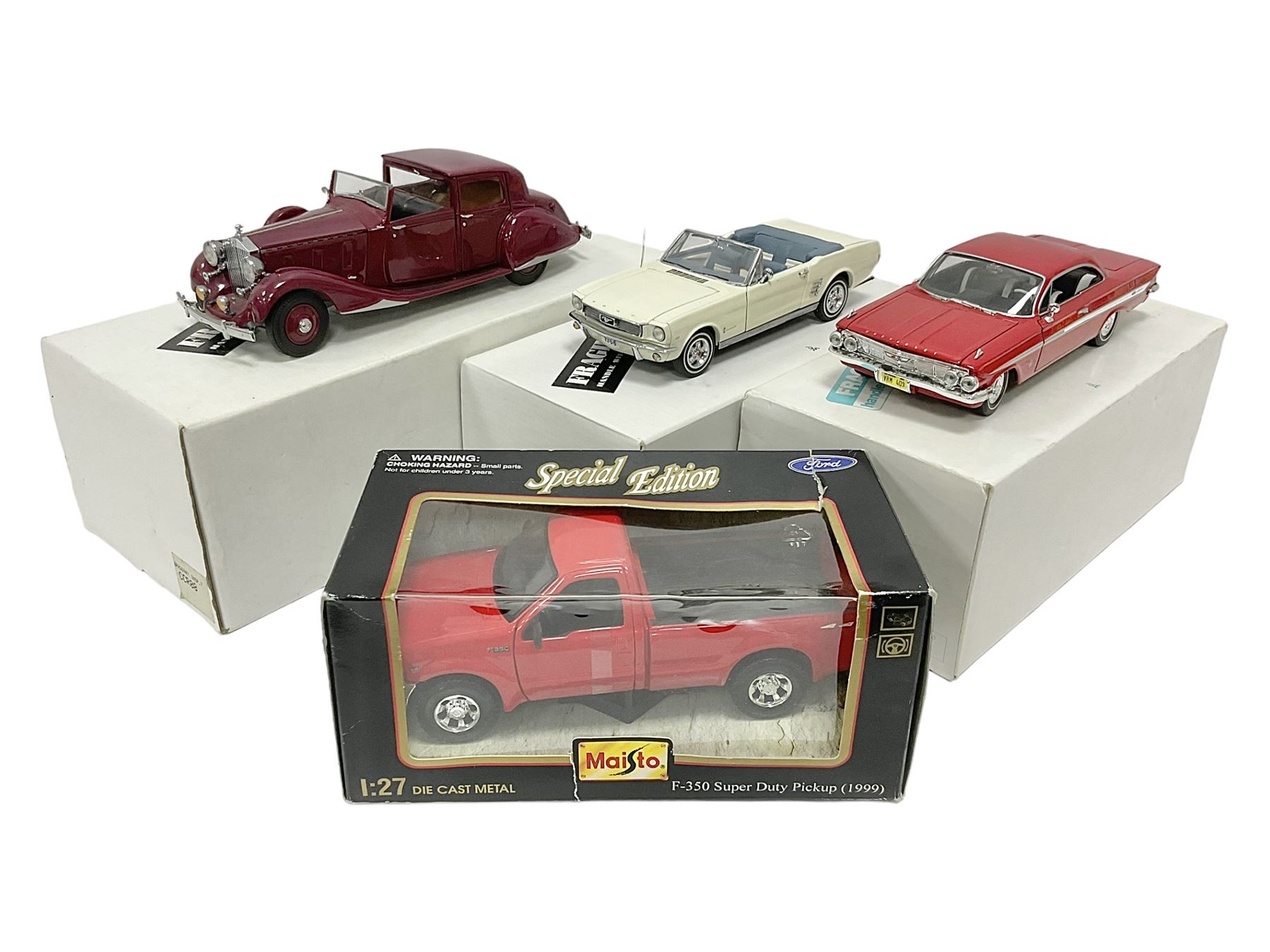 Four metal die-cast models of cars comprising two 1:24 scale