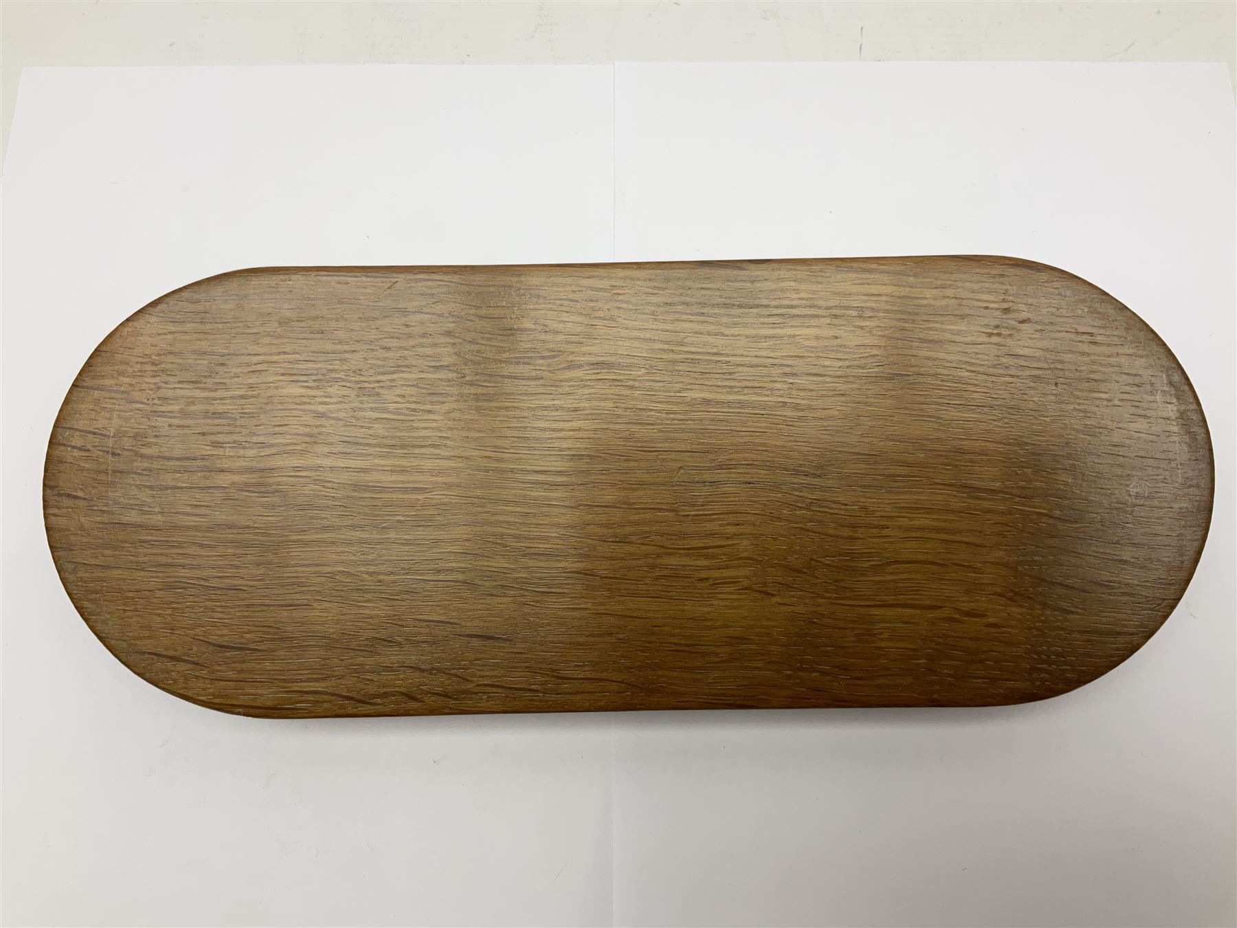 Mouseman - oak pen tray, rectangular form with rounded ends, carved mouse signature over penny moulded edge, by the workshop of Robert Thompson, Kilburn