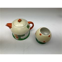 Shelley Boo Boo three piece tea set designed by Mabel Lucie Attwell, comprising teapot modelled as a house, sugar bowl modelled as a toadstool, and creamer modelled as an elf, each with printed marks beneath, together with a Shelley Mabel Lucie Attwell teacup and saucer. 