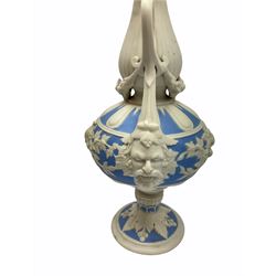 Victorian Parian ware twin handled vase detailed with Bacus masks fruiting vines and floral sprays H36cm, together with a Parian jug H14.5cm, classical Parian sculpture H40cm, decorative plaque decorated in high relief depicting two children D18.5cm. 