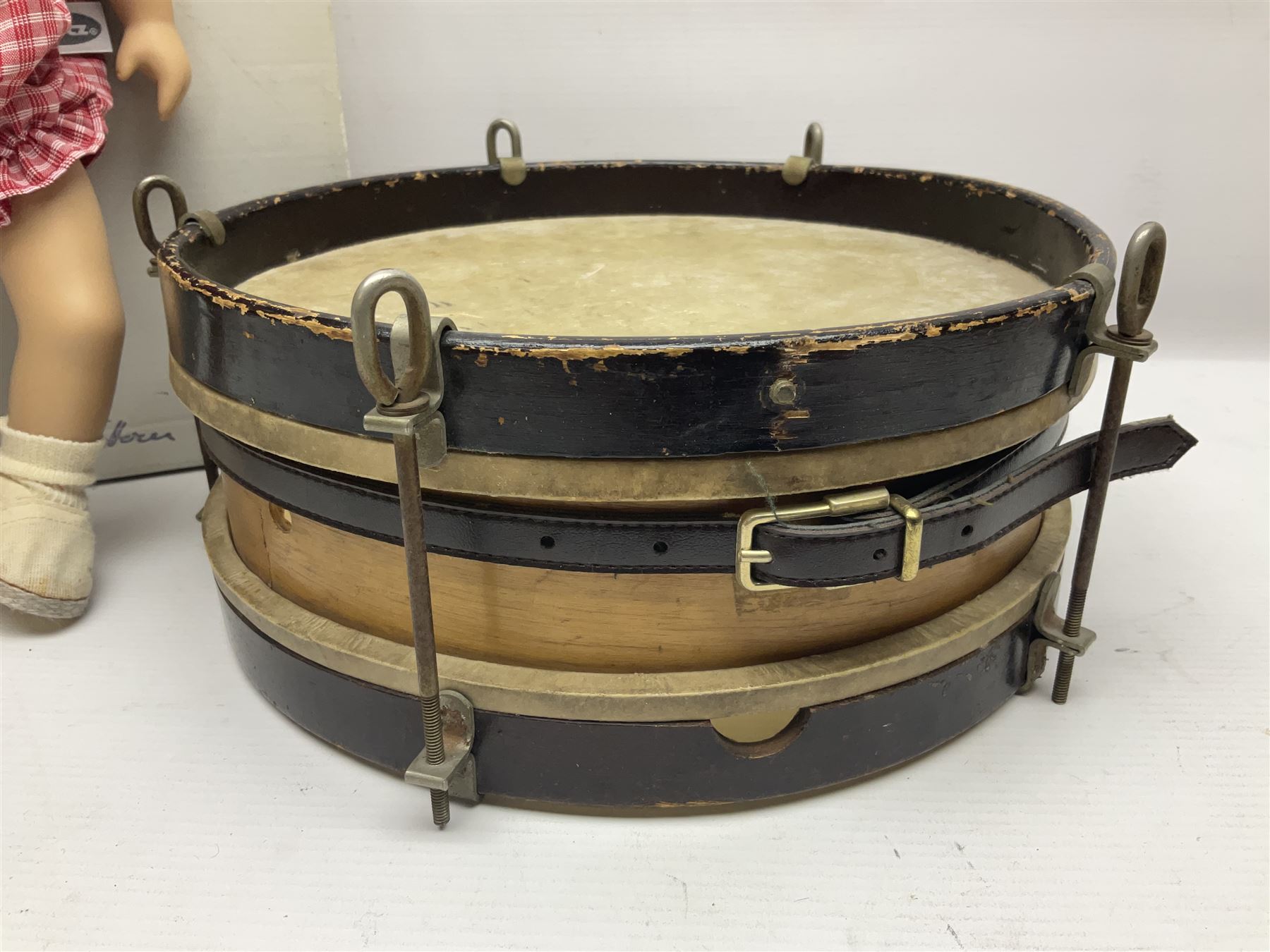 German Gotz articulated vinyl baby doll 'Claire' c1997 with original clothing, hat and labels; artist designed by Sylvia Natterer H35cm; boxed; and small child's wooden cased drum (2)