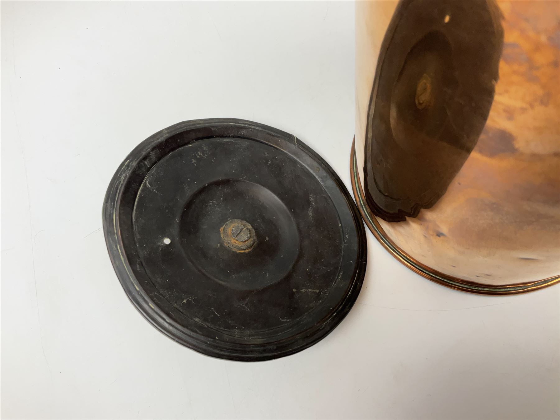 Victorian copper hot water urn, the body of plain cylindrical form with brass tap, the slightly domed lid with brass finial, together with a rectangular copper planter, with twin brass lion mask handles, urn H35cm