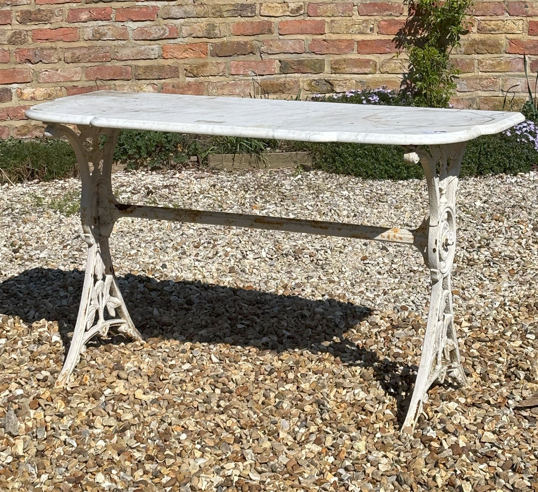 Victorian cast iron garden table by Coalbrookdale, with shaped white marble top on splayed end supports. H71cm, L123cm, D53cm. - COLLECTION BY APPOINTMENT FROM: The White House, Thirsk Road, Easingwold, York, YO61 3NF - CALL 01723 507111 TO ARRANGE
