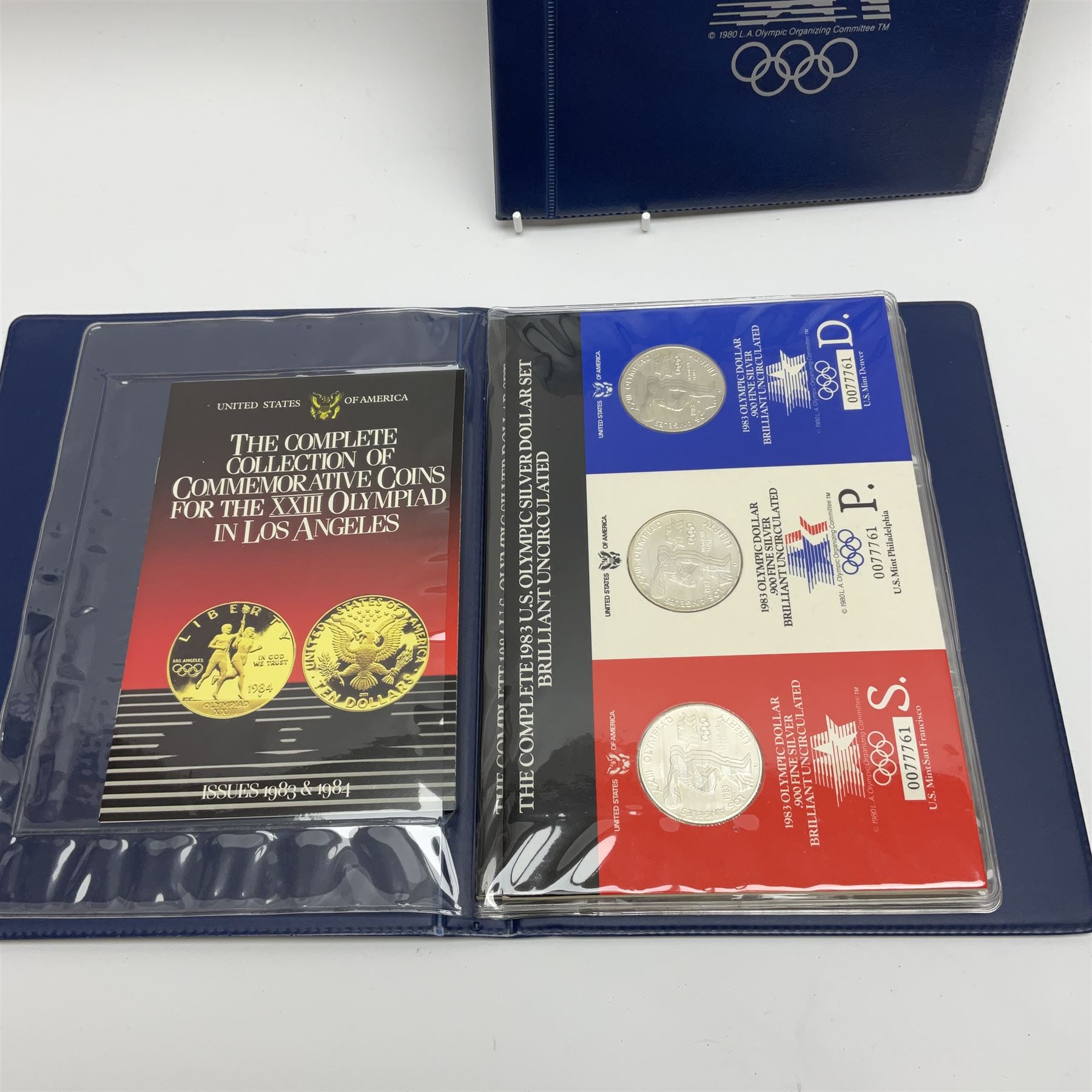 Coins and banknotes including eight United states of America silver dollars, small number of Great British pre 1947 silver threepence pieces,  pre-decimal coins including pennies, Bank of England Hollom five pounds 'H49', Page five pounds '03T' etc
