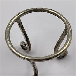 Modern silver limited edition Easter egg, no. 70/500, the gilt openwork body decorated with daffodils and detachable cover with pierced circular panel set with a single faceted blue stone, opening to reveal a gilt interior, upon silver stand with three scrolling pad feet, each hallmarked St James House Company, London 1980, height including stand 8cm