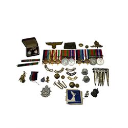  Collection of cap and other badges, buttons etc together with copies of WWII medals, including The African Star, The 1939-1945 Star, The Italy Star etc  