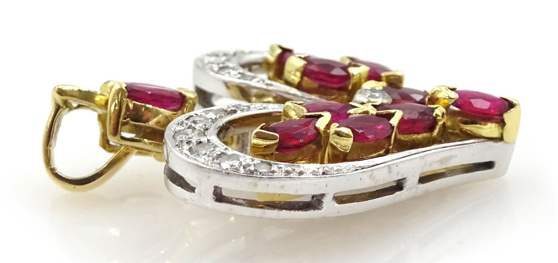 18ct white and yellow gold round brilliant cut diamond and marquise cut ruby heart shaped pendant, London 1983