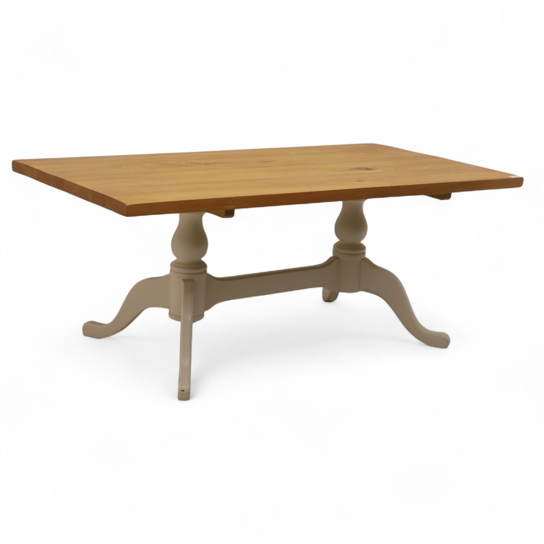Contemporary light oak dining table, painted tripod bases with stretcher 