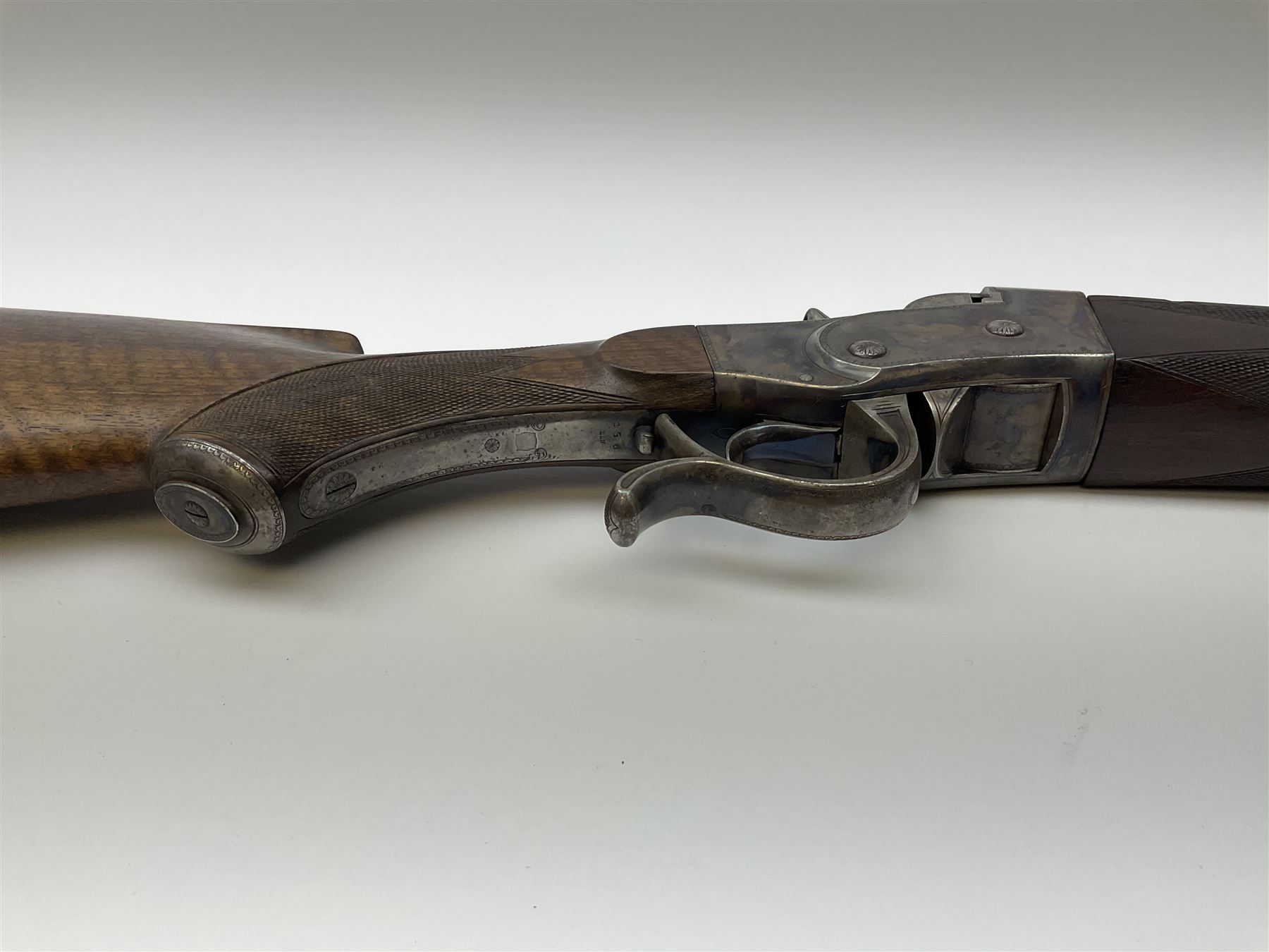 Rare Henry Pieper Liege seven-chambered solid barrel 297/30 calibre rim-fire volley gun with six barrels around a central seventh barrel drilled for simultaneous fire, built on a Remington type rolling block action, blued 62cm barrel with raised rib and twin rear leaf sights, case hardened action complete with loading plate for seven cartridges, walnut stock with chequered pistol grip and fore-end and inset 'silver' cartouche with two Chinese type characters, no.256PLN, L109cm overall