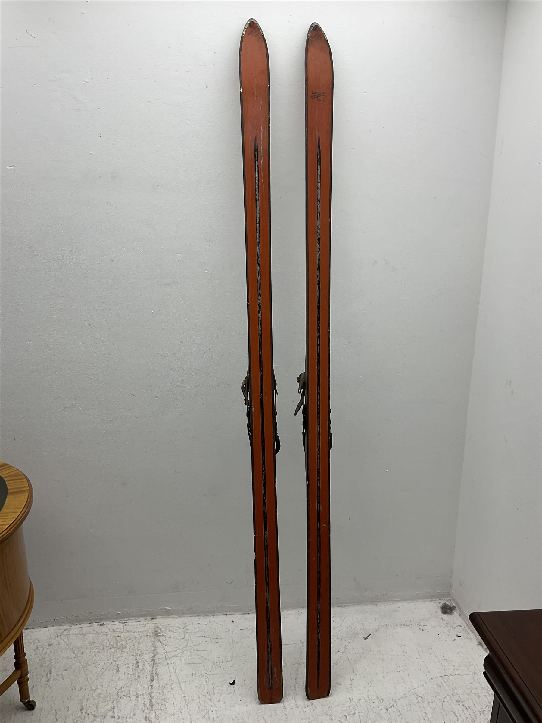 Pair of 1930s wooden skis, with painted metal runners beneath stamped Attenhofer, with retailers label for Ernst Gertsch Central Sports, L206cm