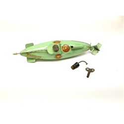Sutcliffe Models ‘Nautilus’ tinplate and clockwork submarine from Walt Disney’s ’20,000 Leagues Under The Sea’ by Jules Verne, sea green body with various decals, rubber bung with periscope, boxed with inner cardboard display piece, produced between 1955-1960