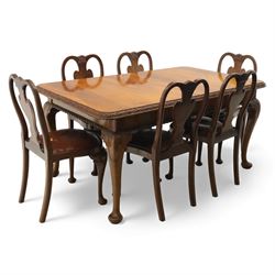 Queen Anne design walnut dining suite, comprising a rectangular dining table with carved moulded edge and rounded corners, raised on cabriole legs terminating in pad feet, together with a set of six matching dining chairs, each with shaped splat back, leather upholstered seat and cabriole supports (Extends to 230cm)