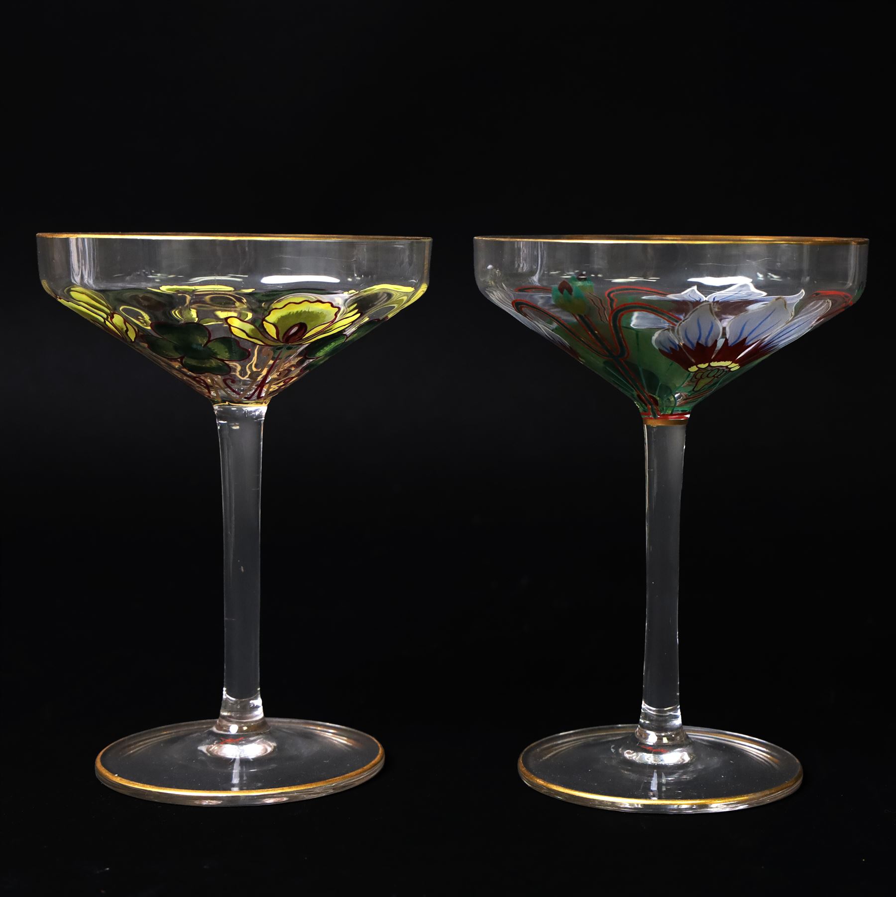Pair of early 20th century Theresienthal Art Nouveau hand painted glass champagne coupes, the bowls hand painted with flowers, the bowl and foot rims lined in gilt, H13.5cm