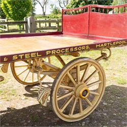 Advertising Trade Dray Wagon for C. Herring & Son, Hartlepool, Dated 1895 and Renovated 1975

An exceptionally decorative late Victorian horse drawn advertising trade dray, built by J. Herring of Hartlepool in 1895 and later renovated by C. Herring in 1975, as recorded by the painted inscription beneath the body. Finished in a striking cream and maroon livery with extensive hand painted signwriting, the wagon carries the name C. Herring & Son, Iron & Steel Processors, Hartlepool along its sides and rear panels. The wagon is fitted with a flat timber loading bed, twin shafts for a single horse, elegant spoked wooden wheels, iron bound tyres, rear headboard and traditional undercarriage with leaf spring suspension. Richly detailed scrollwork and lining throughout make this a particularly attractive example, suitable for collection, display, museum, promotional or coaching purposes.

Features

• Built by J. Herring, Hartlepool, 1895
• Renovated by C. Herring in 1975
• Original style hand painted advertising signwriting
• Flat timber loading platform
• Raised rear headboard with decorative pierced gallery
• Twin shafts for a single horse
• Wooden spoked wheels with iron tyres
• Traditional leaf spring suspension
• Extensive decorative lining and scrollwork throughout
• Attractive cream and maroon colour scheme
• Suitable for private collection, museum or display use

Dimensions:
Overall length: 560 cm
Body length: 300 cm
Width: 158 cm
Height: 150 cm

Wheel Diameters:
Front wheels: 76 cm
Rear wheels: 86 cm