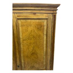 Frank Hudson - mid-20th century Mindi ash and burr walnut double wardrobe, moulded rectangular cornice over two panelled doors with chevron pattern veneers, raised on turned supports