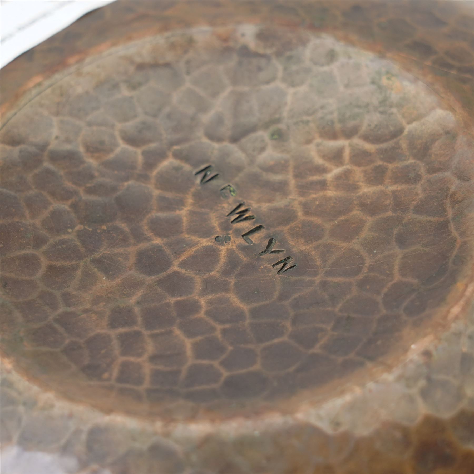 Newlyn school Arts and Crafts copper rose bowl, the planished exterior with fruit and leaves in high relief, H8.5cm x W18cm