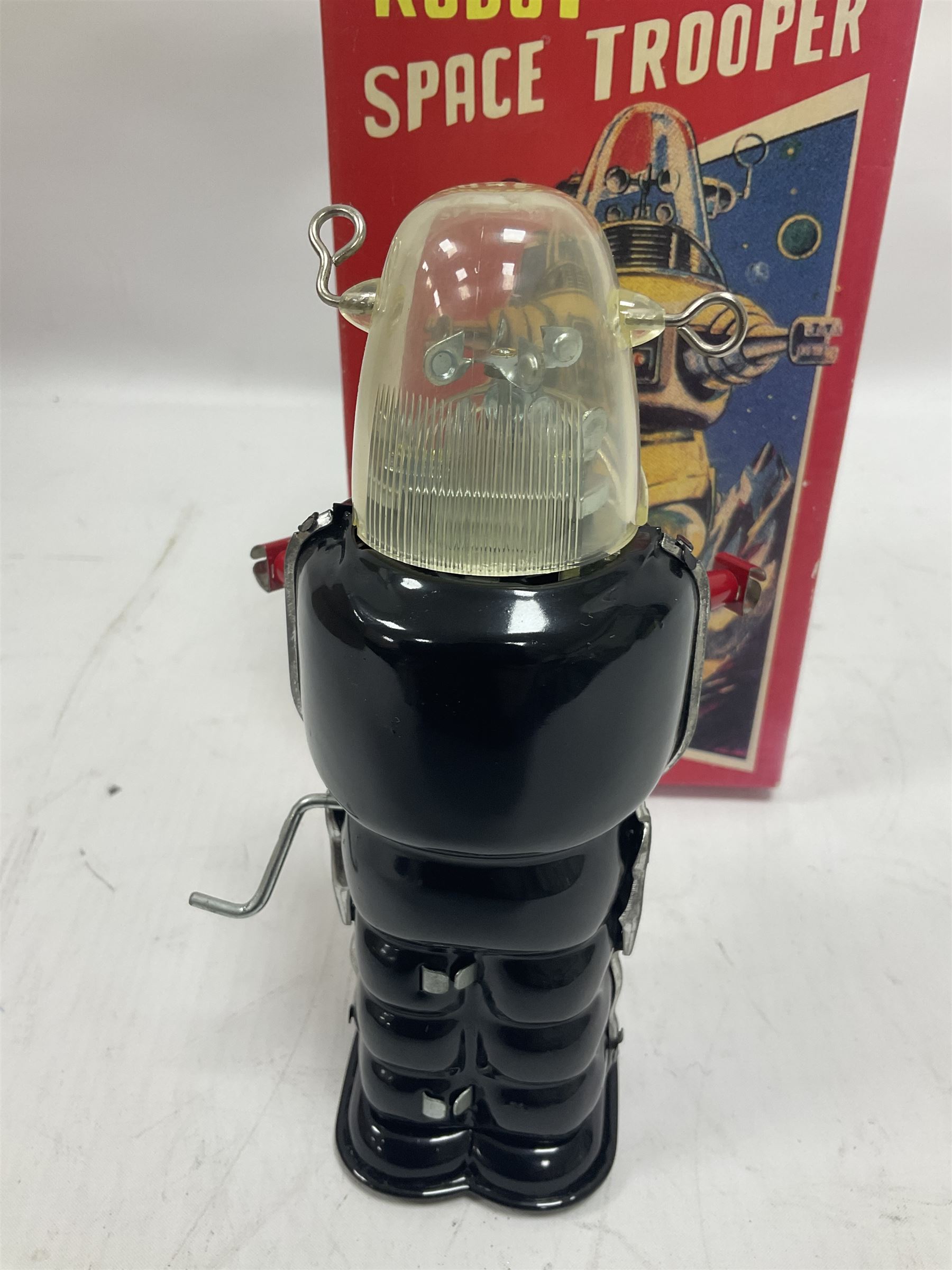 Three vintage battery operated robots comprising tin-plate Space Walk Man ME 100 Robot, Saturn the 13