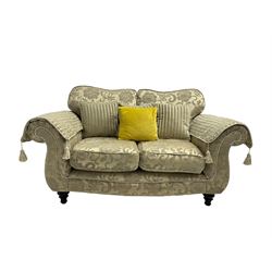 DFS - two seat sofa (W160cm, H90cm, D95cm), and armchair (W103cm), upholstered in pale gold fabric decorated with scrolling foliate pattern, with scatter cushions and arm covers