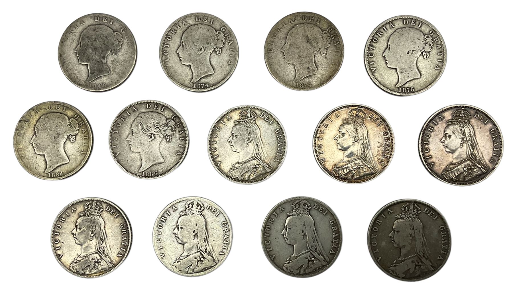 Thirteen Queen Victoria halfcrown coins, dated 1849, two 1874, 1875, 1884, 1886, three 1887, two 1889, 1891 and 1892 (13)