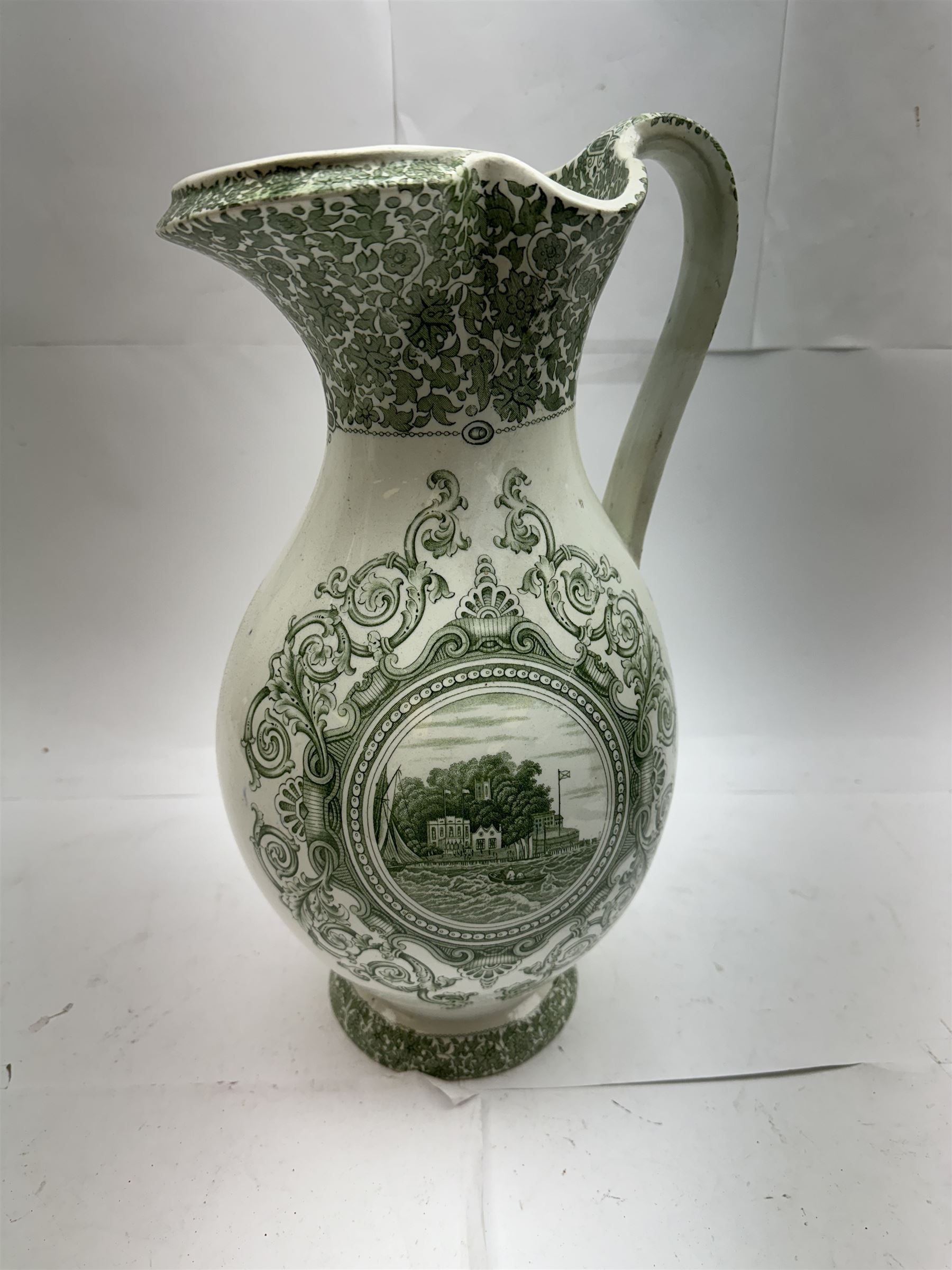 19th century Copeland & Garrett New Blanche wash jug, with green transfer printed decoration of 'West Cowes', H36cm, together with a treacle glaze pottery puzzle jug, H28cm