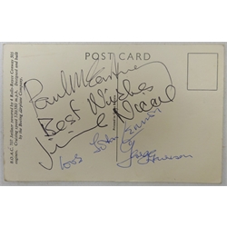  RTV   The Beatles - four signatures on the reverse of a B.O.A.C. Rolls-Royce 707 Jetliner postcard comprising Paul McCartney, Jimmie Nicol, John Lennon and George Harrison.  In June 1964 The Beatles were about to embark on a tour which would take in Denmark, The Netherlands, Australia and New Zealand before returning to the UK but a few days before the start of the tour Ringo was rushed to hospital with severe tonsillitis and needed an immediate operation. Cancellation of the tour at this late stage would have caused a great deal of problems so Brian Epstein looked for, found and auditioned another drummer, Jimmie Nicol. Although George Harrison was not happy with the arrangement the tour proceeded with Nicol as their drummer. As soon as Ringo recovered he flew to Melbourne and joined The Beatles who then went on to finish the tour. Nicol only played eight shows and was a Beatle for just thirteen days as he was flown home the very next day after Ringo's arrival in Melbourne.  Provenance: the signatures were given to the BOAC pilot who flew the Beatles on the tour. He then passed them on to his friend the Mayor of Chipping Norton, where he lived, and the vendor is the widow of the Mayor.