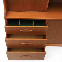 Jentique - mid-20th century teak highboard, fall front cabinet next to a sliding door cupboard above and open recess, the lower section with cabinet doors and three graduated drawers, raised on cylindrical legs