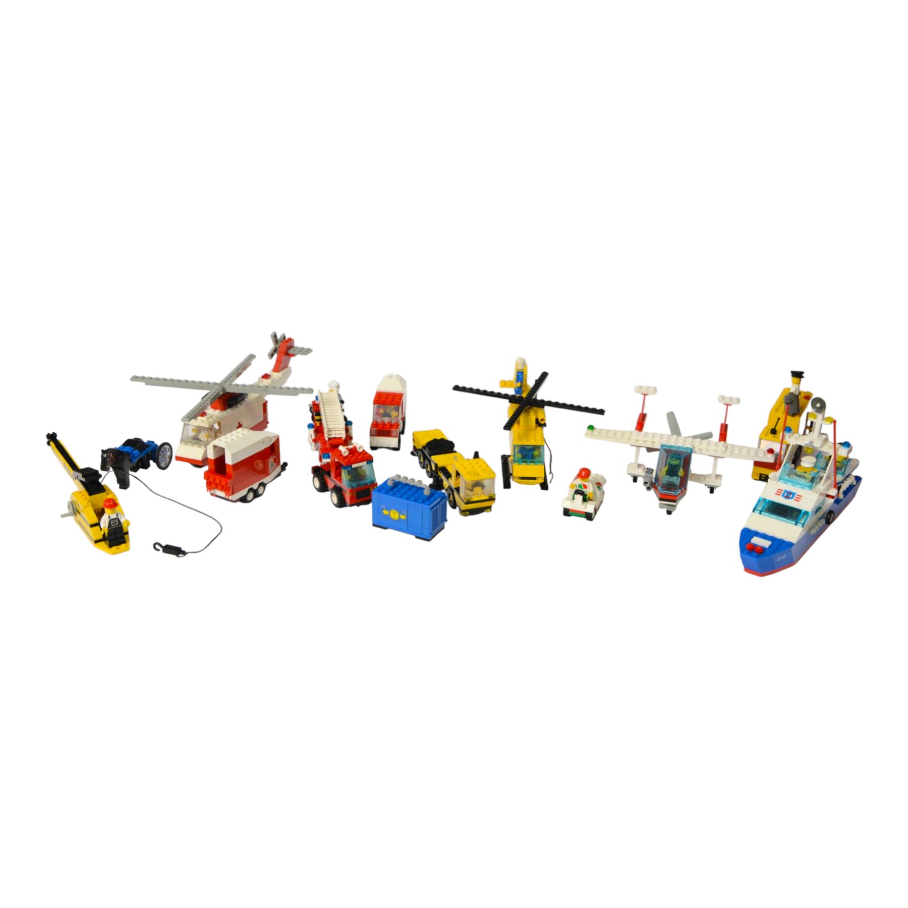Eight vintage Lego Classic Town vehicles, comprising no. 6853 Coastal Cutter, no. 6359 Horse Trailer, no. 6693 Recycle Truck, no. 6361 Mobile Crane, no. 6340 Hook and Ladder, no. 6691 Red Cross Helicopter, no. 6341 Gas 'n' Go Flyer and no. 6697 Rescue Helicopter, all built with minifigures