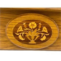 Light oak fire surround, set with three inlaid roundels