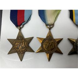 Representative display of WWII Campaign stars comprising 1939-1945 Star, Atlantic Star, Air-Crew Europe Star, Africa Star and Pacific Star; together with the corresponding group of miniatures; all with ribbons