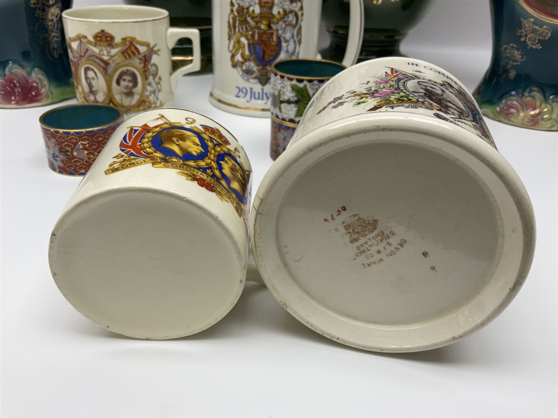 Set of four Chinese cloisonne enamel napkin rings, together with a pair of Strasburg Ware vases, a pair of similar larger continental vases and four Royal commemorative mugs