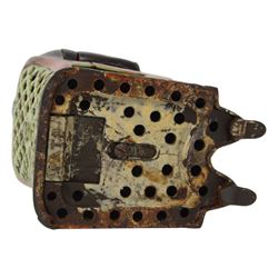 Late 19th century American cast iron Tammany mechanical money box, modelled as a suited gentleman with yellow waistcoat seated in a red and green chair, with two patent marks for Dec 23rd 1873 and June 8th 1875, H14cm