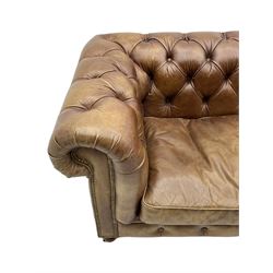 HALO - Chesterfield style four seat sofa upholstered in buttoned brown leather with stud work, on turned feet with castors
