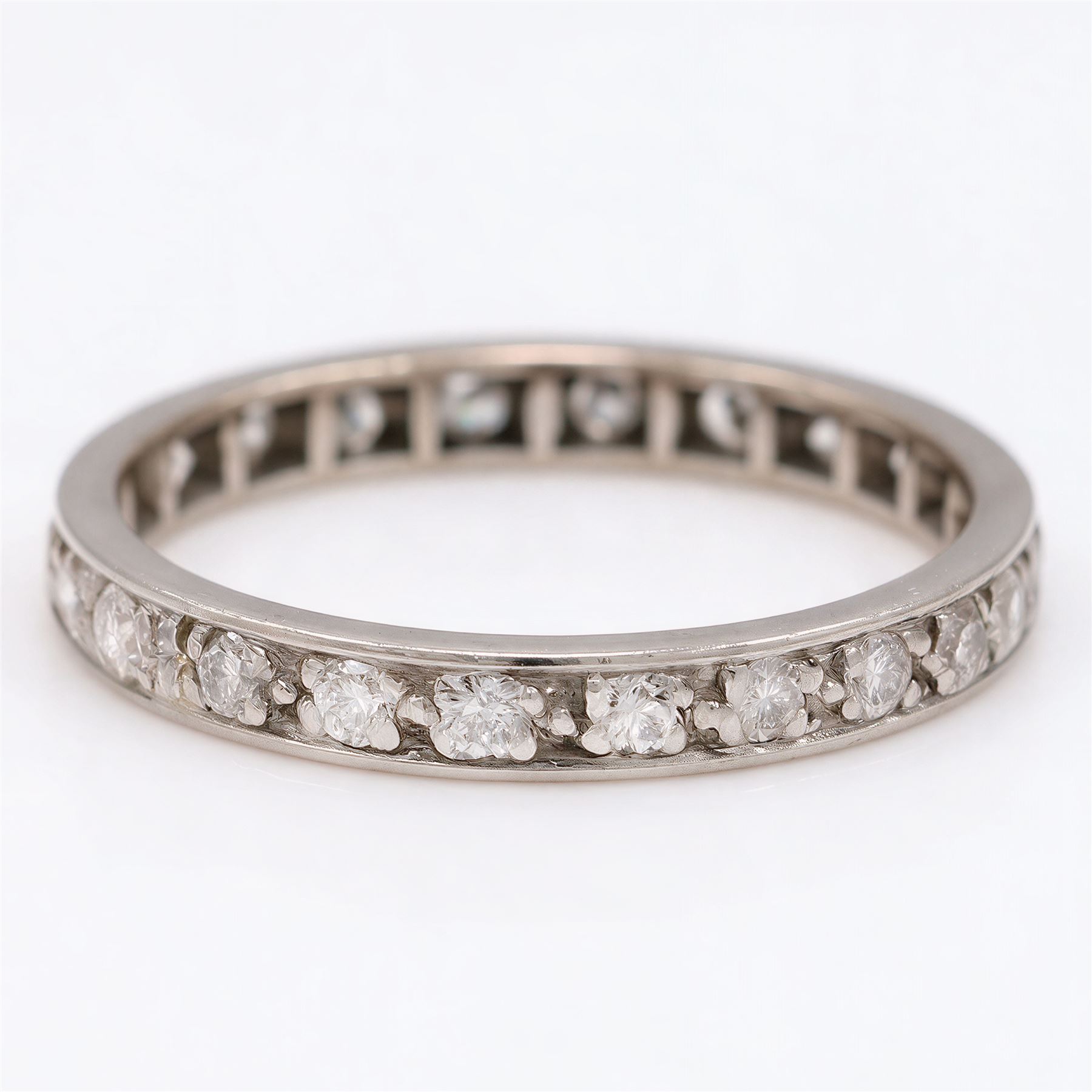Palladium diamond full eternity ring, set with twenty-three round cut diamonds, total diamond weight approx 0.70 carat