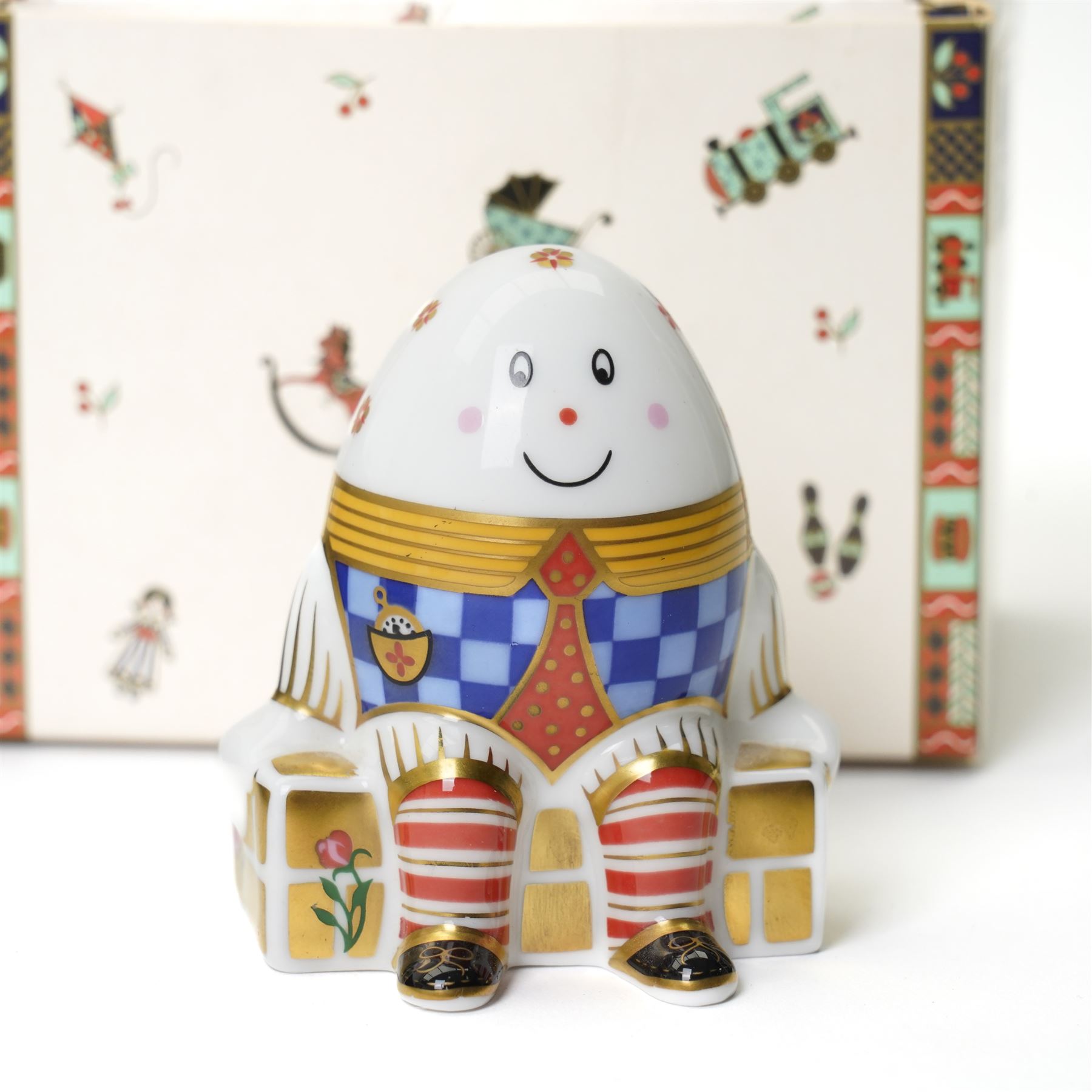 Royal Crown Derby 'Treasures of Childhood' miniature tea service, together with Humpty Dumpty figure, ragdoll, mug, and miniature sugar bowl, all boxed 