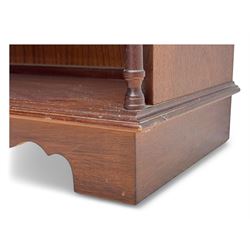 Mid-20th century mahogany open bookshelf, the rectangular top with a brass balustrade gallery, over three shelves each supported by turned column uprights, on shaped apron base