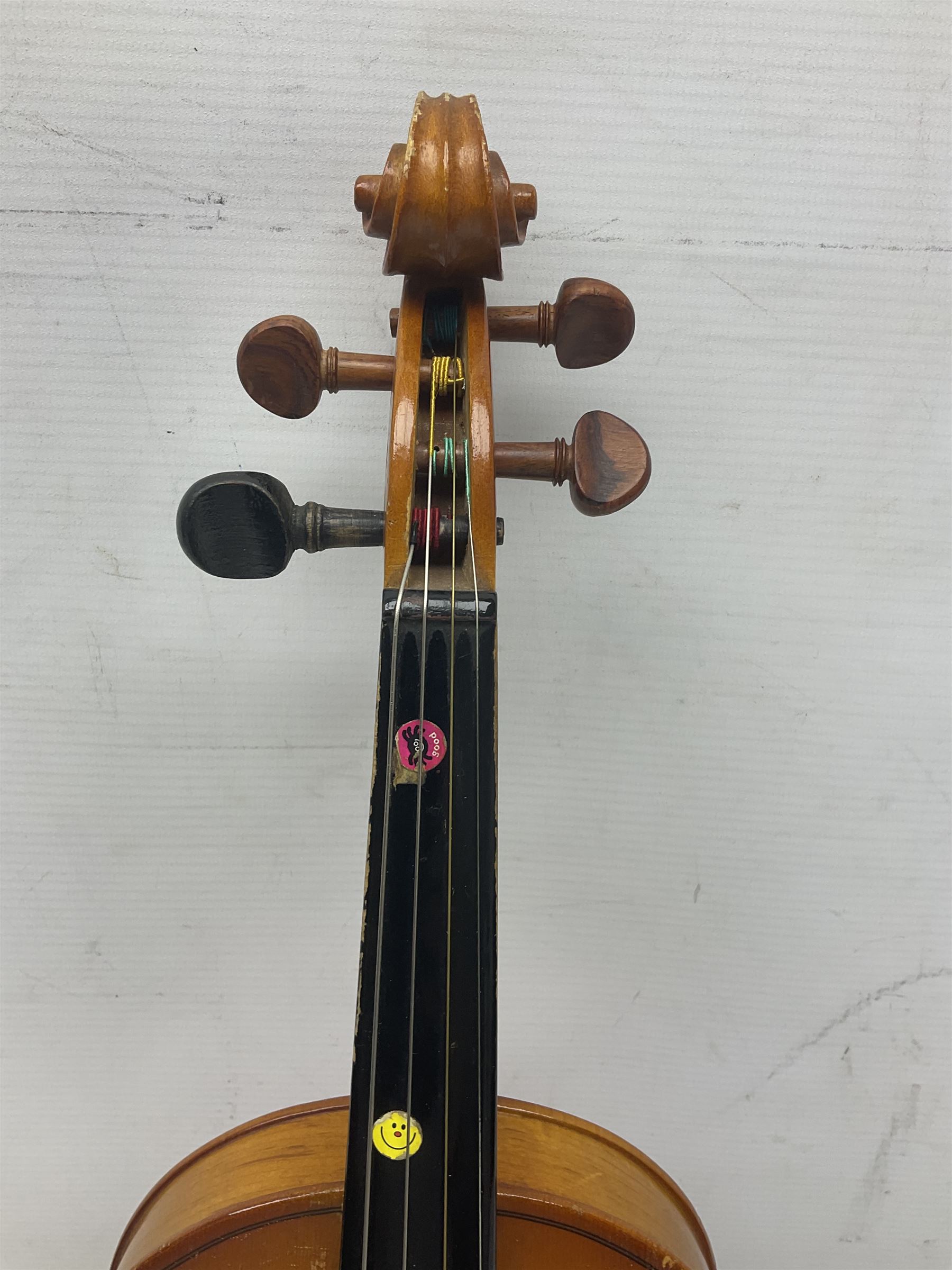 Four Chinese graduated violins - full size with 35.5cm two-piece back; three-quarter size with 33.5cm two-piece back; half size with 31cm two-piece back; and quarter size with 27.5cm two-piece back; all cased except full size; one with bow (4)
