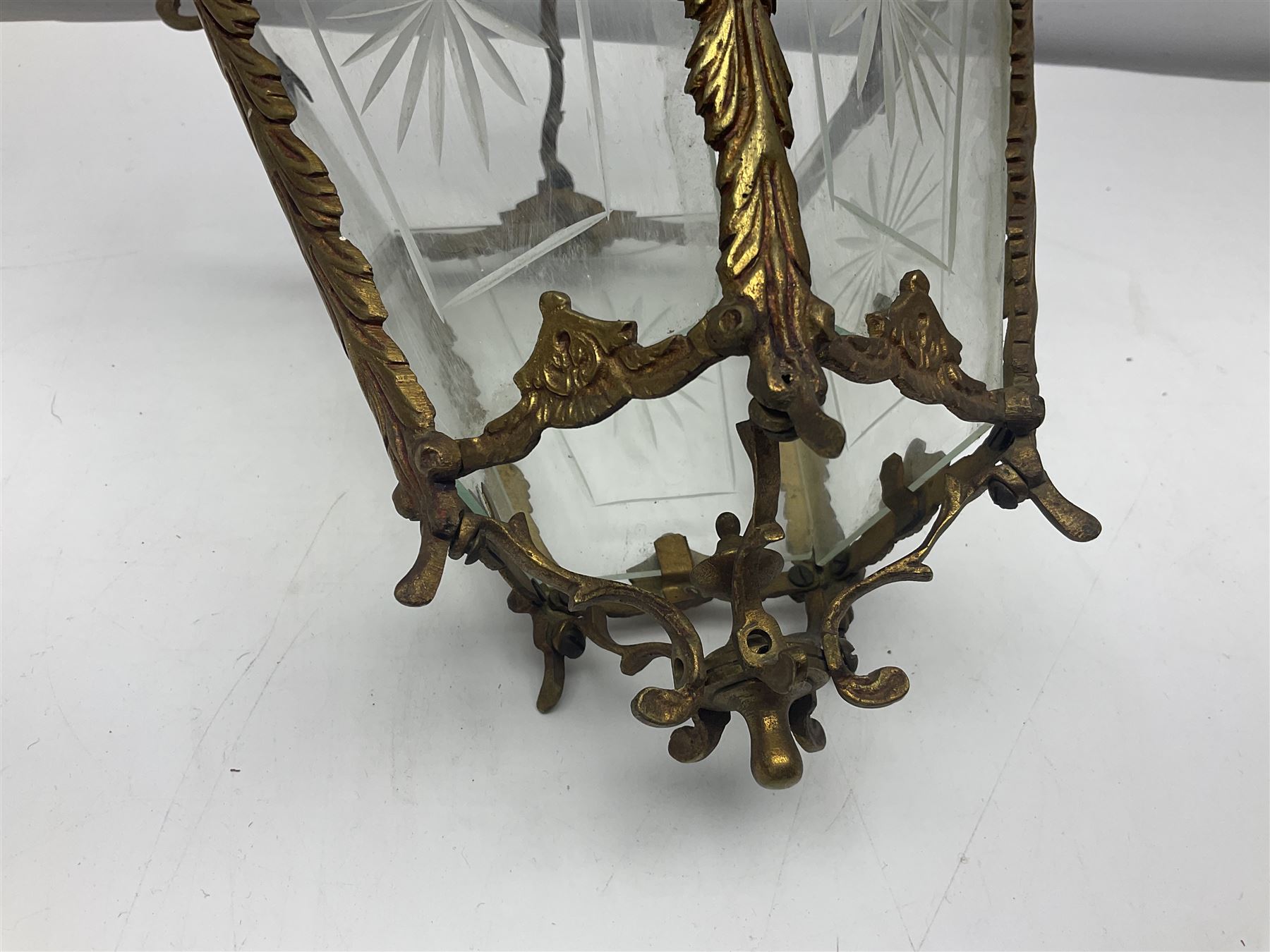 Edwardian floral cast gilt brass hall lantern of tapered pentagonal form, the five glass panels with etched decoration, overall approx L36cm excl chain