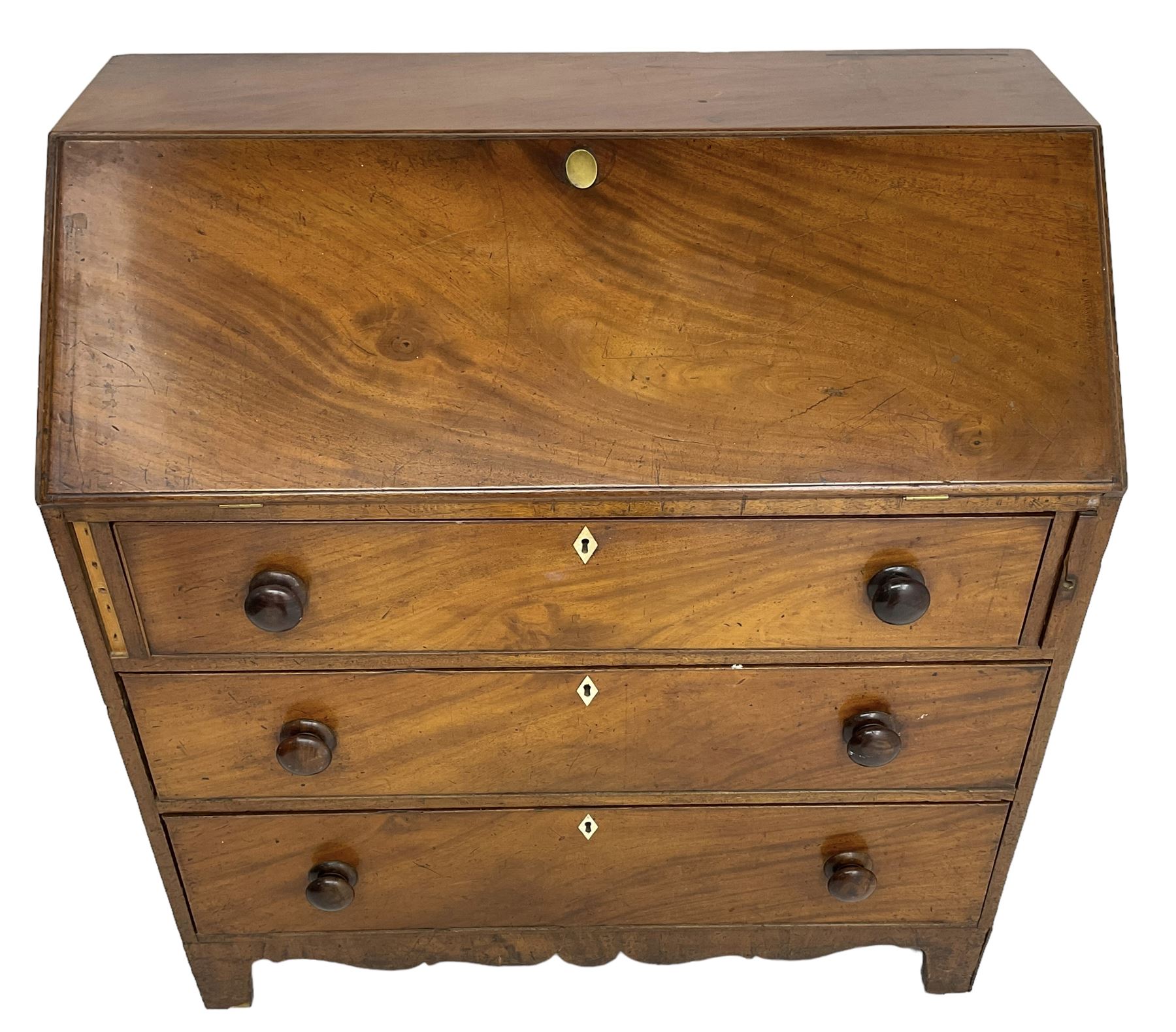 George III mahogany bureau, the fall front enclosing interior fitted with pigeon holes, drawers and cupboard, three graduating drawers below, with ivory escutcheons, shaped apron on bracket feet 

This item has been registered for sale under Section 10 of the APHA Ivory Act
